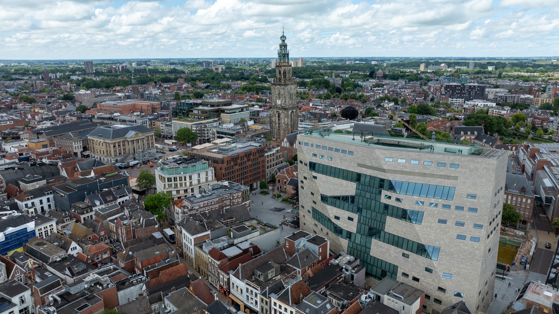 Aerial view of Groningen city center with Martinitoren and Forum Groningen, professional drone photography, urban landscape