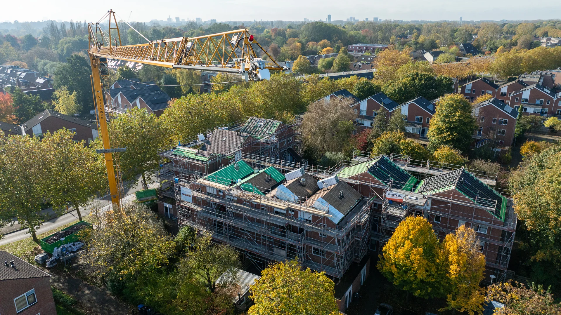 construction workers on high building site with safety equipment, dangerous working conditions, industrial construction, aerial perspective showing scale and risk