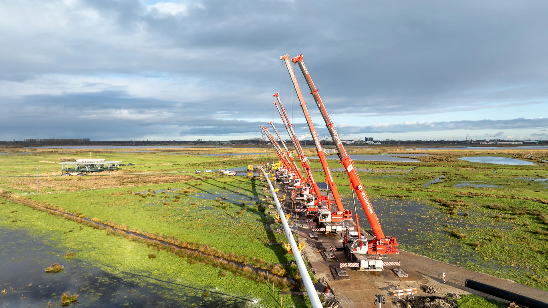 cinematic aerial video production of industrial complex at sunset, professional drone filming, industrial marketing content, dramatic lighting